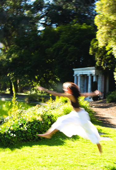 woman leaping on grass